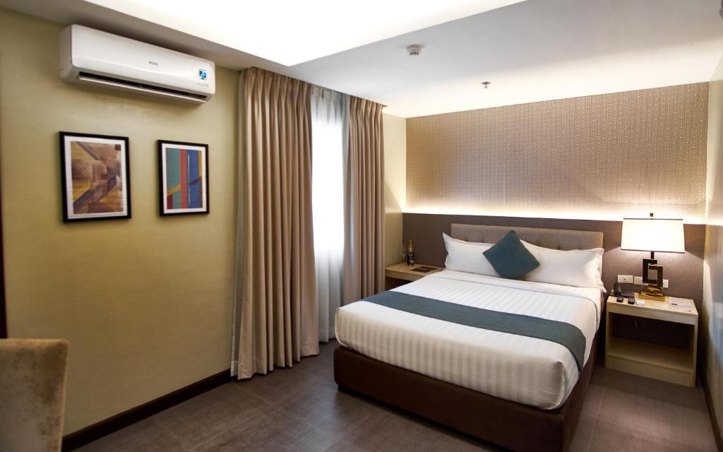 Postel nebo postele na pokoji v ubytování J7 Hotel