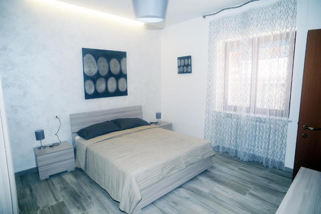 A bed or beds in a room at Casa Di Vita