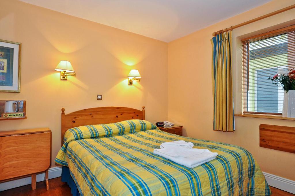 Postel nebo postele na pokoji v ubytování Boffin Lodge Guest House