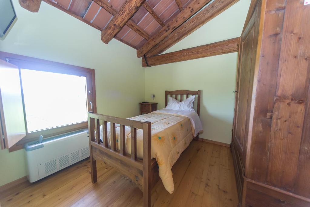 Postel nebo postele na pokoji v ubytování Agriturismo Cjasal di Pition