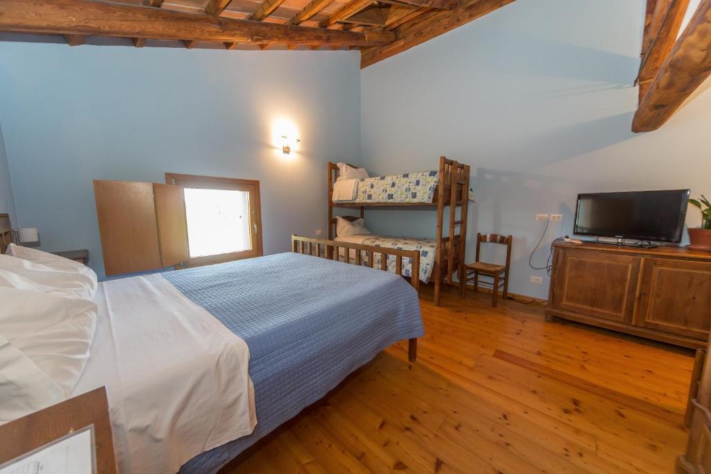 Postel nebo postele na pokoji v ubytování Agriturismo Cjasal di Pition