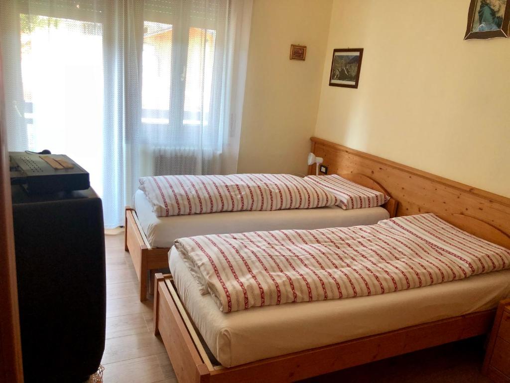 Postel nebo postele na pokoji v ubytování Stella Alpina