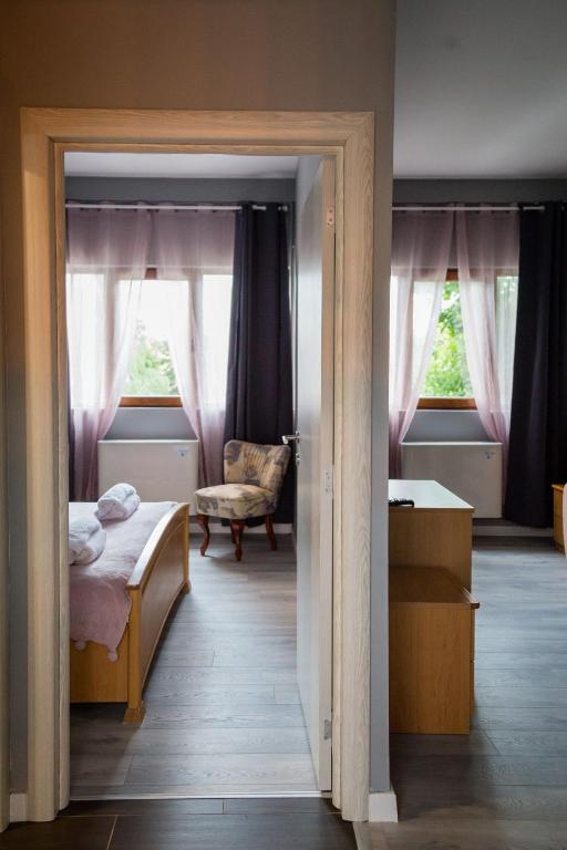 Postel nebo postele na pokoji v ubytování Green Town Apartments