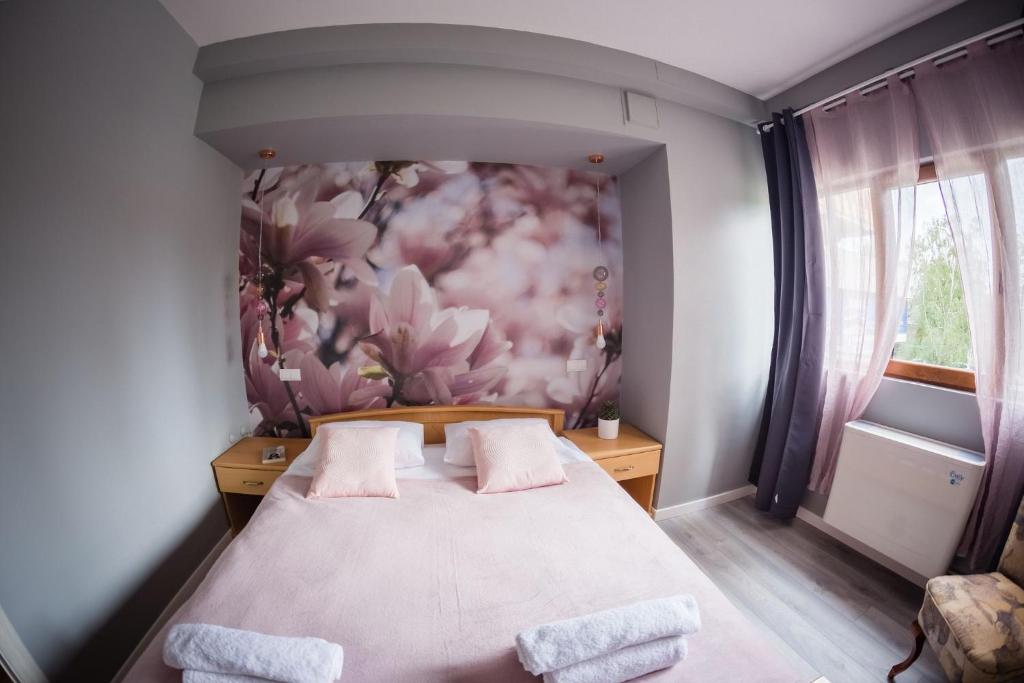 Postel nebo postele na pokoji v ubytování Green Town Apartments