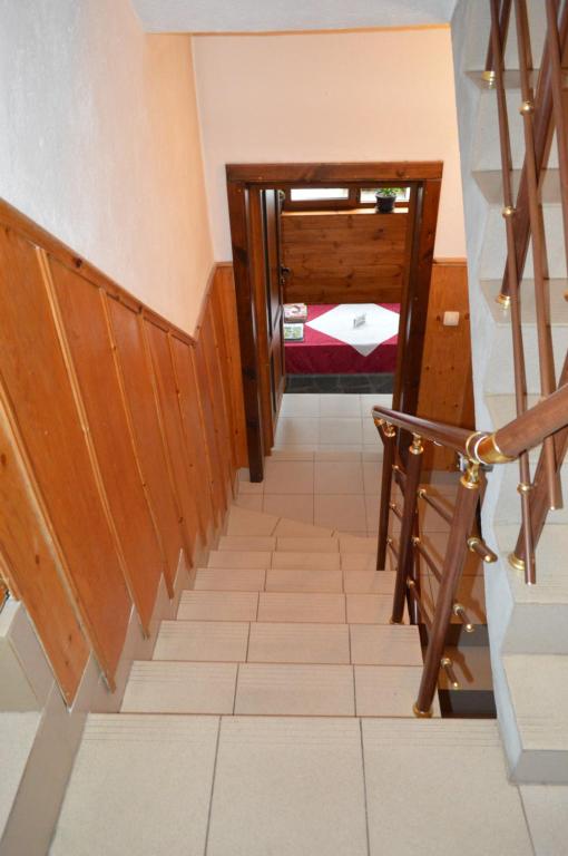 A bed or beds in a room at Baba Dora Guesthouse