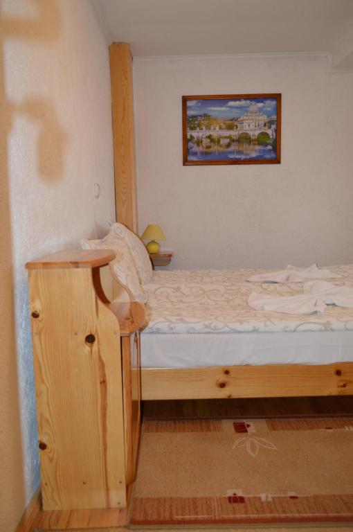 A bed or beds in a room at Baba Dora Guesthouse