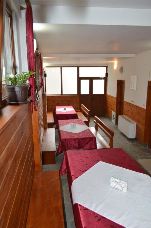 A bed or beds in a room at Baba Dora Guesthouse