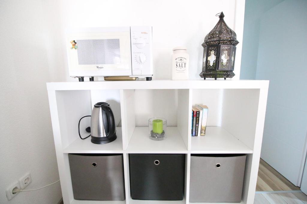 Příslušenství pro přípravu čaje a kávy v ubytování Apartments by Zec