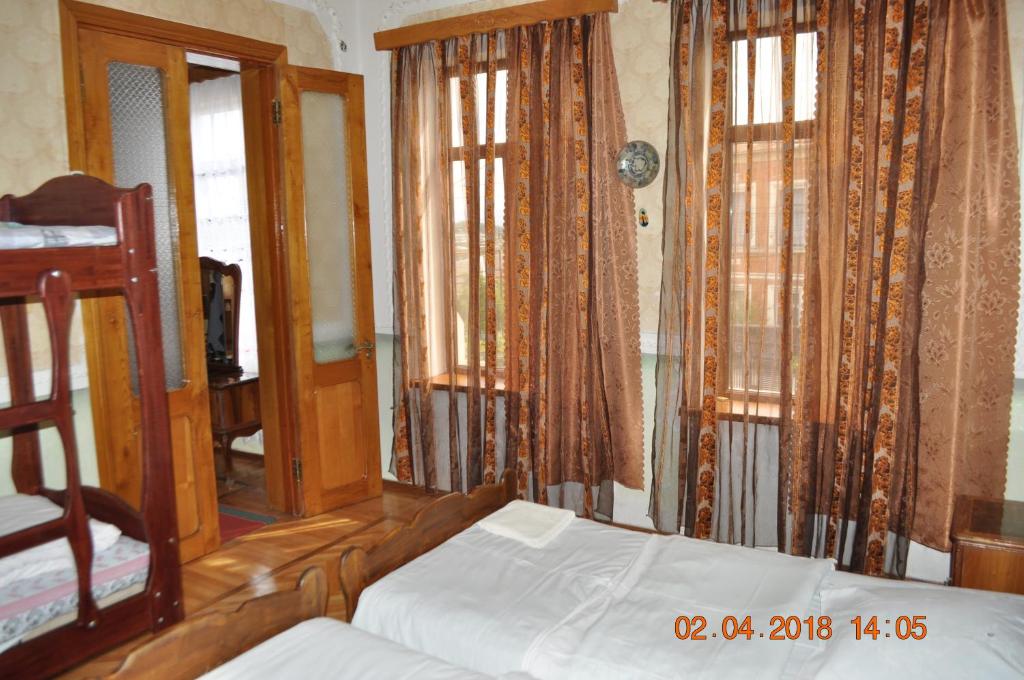 Postel nebo postele na pokoji v ubytování Hotel Kharabadze