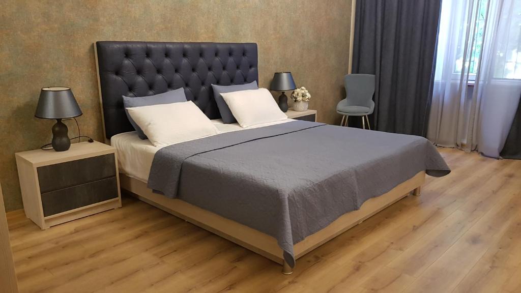 Postel nebo postele na pokoji v ubytování Hotel Griboedov
