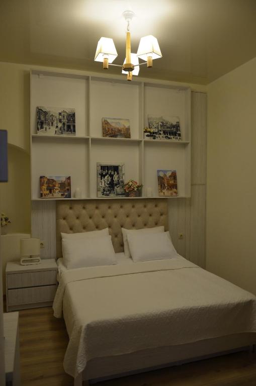 Postel nebo postele na pokoji v ubytování Hotel Griboedov