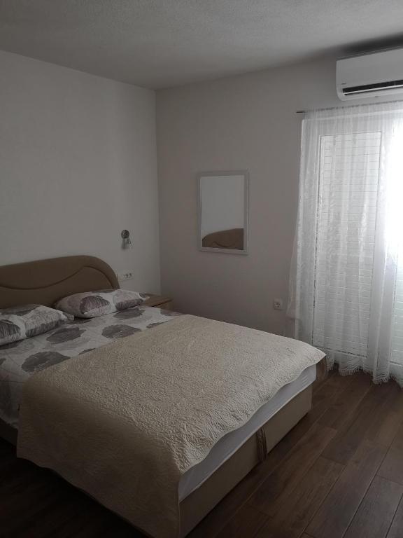 Postel nebo postele na pokoji v ubytování Apartmani Sea