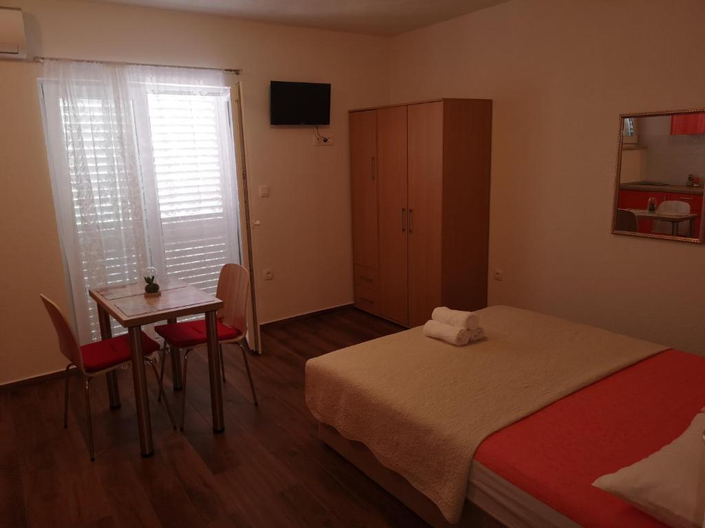 Postel nebo postele na pokoji v ubytování Apartmani Sea