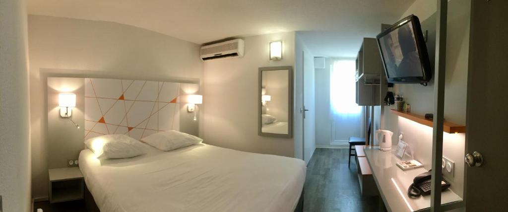 Postel nebo postele na pokoji v ubytování Hotel du Parc Euromédecine by AKENA