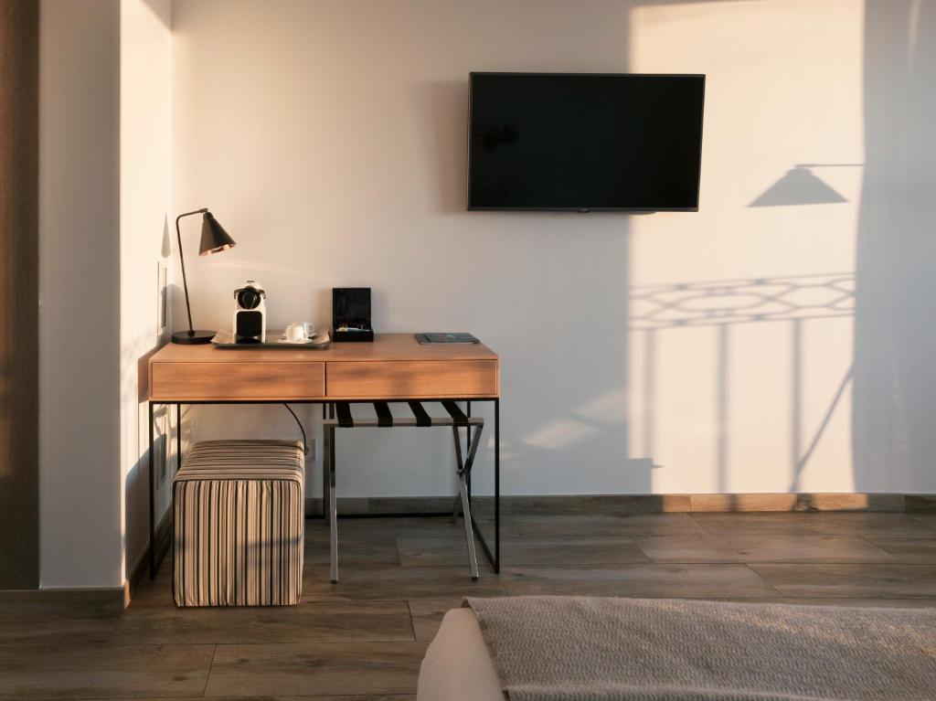 Televízia a/alebo spoločenská miestnosť v ubytovaní Hotel Boutique Balandret