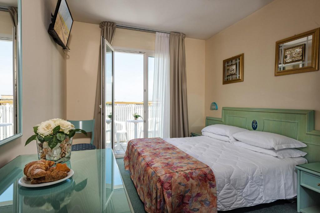 Postel nebo postele na pokoji v ubytování Salus Smart & Chic Hotel