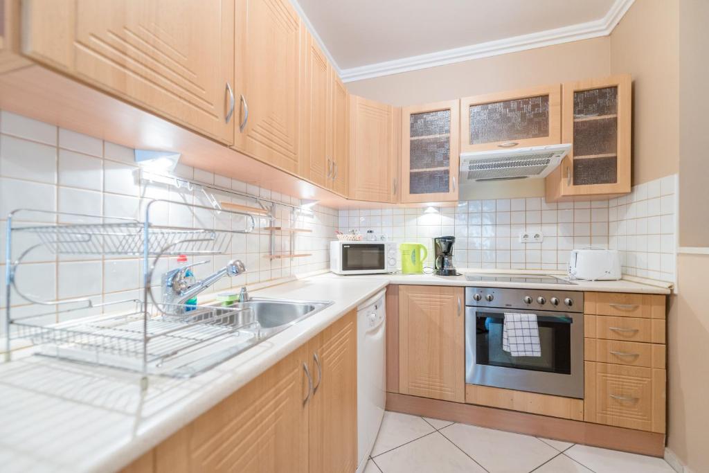 Kuchyňa alebo kuchynka v ubytovaní Nova Apartments