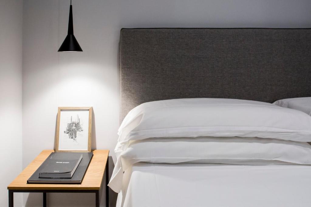 Postel nebo postele na pokoji v ubytování Trieste 411 - Rooms & Apartments