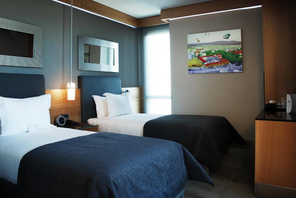 Postel nebo postele na pokoji v ubytování Point Hotel Barbaros