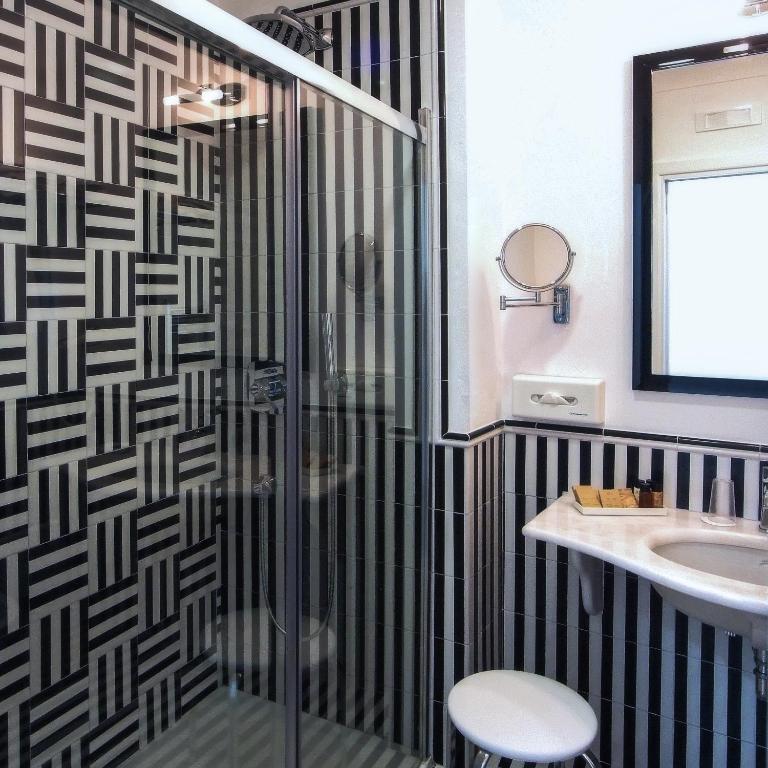 a bathroom with a shower and a sink at Hotel Montemare in Positano