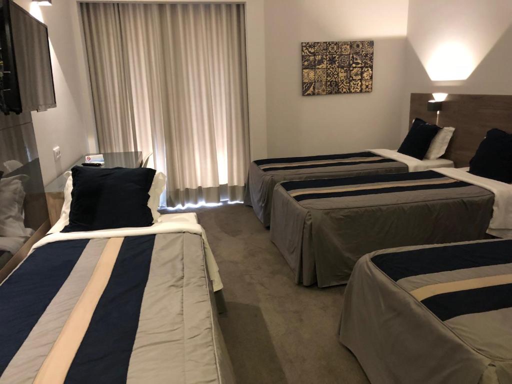 Postel nebo postele na pokoji v ubytování Hotel do Parque