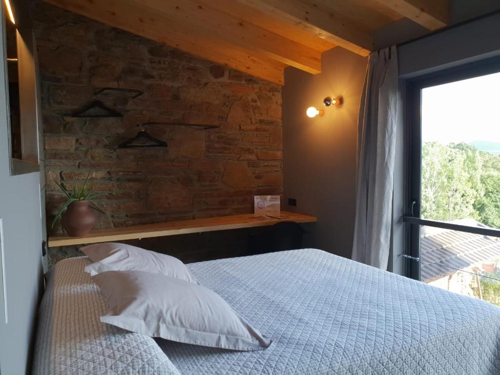 Postel nebo postele na pokoji v ubytování Cal Serni