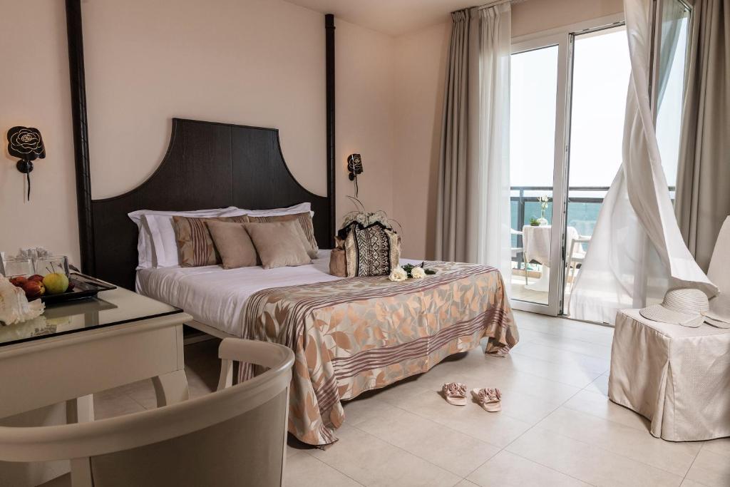 Postel nebo postele na pokoji v ubytování Baia del Mar Beach Boutique Hotel