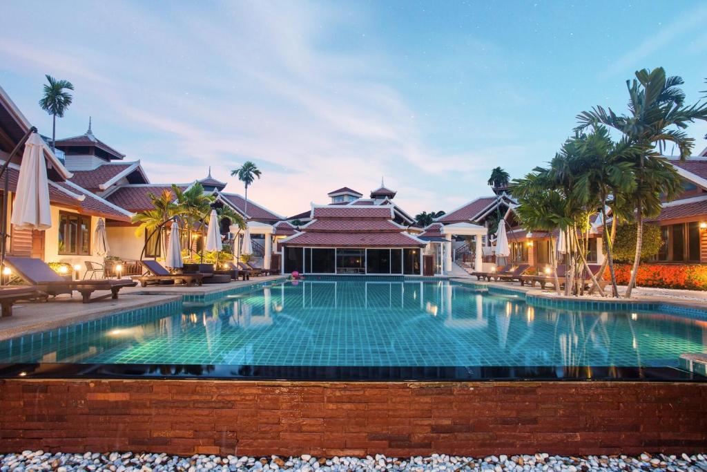 an image of a swimming pool in a villa at Achawalai Residence Village By Song in Jomtien Beach