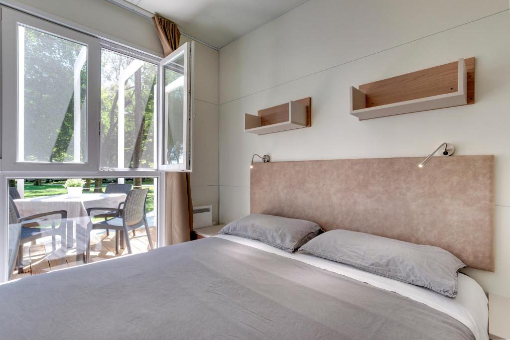 Postel nebo postele na pokoji v ubytování Camping Fusina