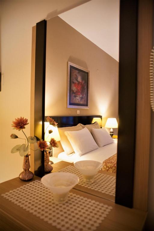 Łóżko lub łóżka w pokoju w obiekcie Palmira Apartments