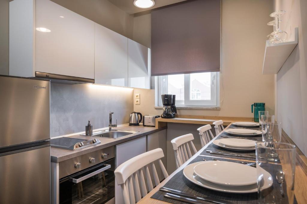 Kuchyňa alebo kuchynka v ubytovaní Sun Ray Luxury Apartments