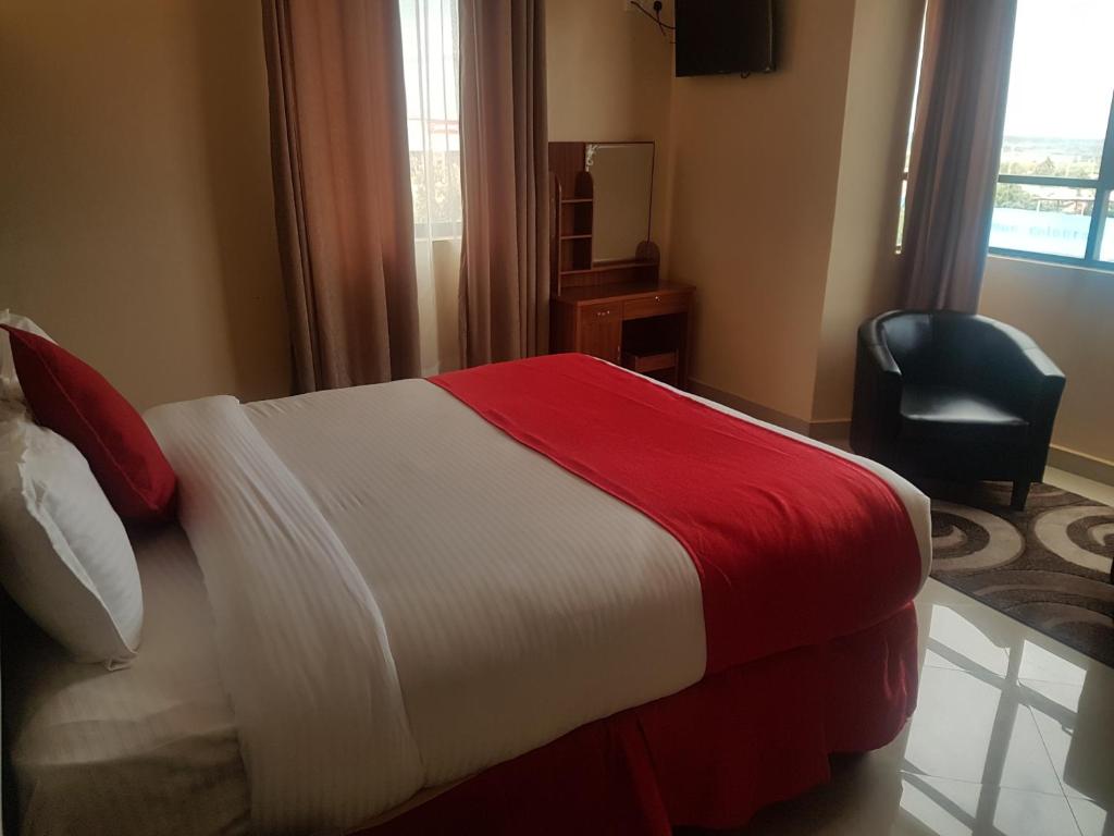 Postel nebo postele na pokoji v ubytování Mara Frontier Hotel