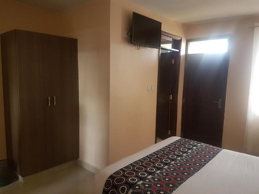 Postel nebo postele na pokoji v ubytování Mara Frontier Hotel