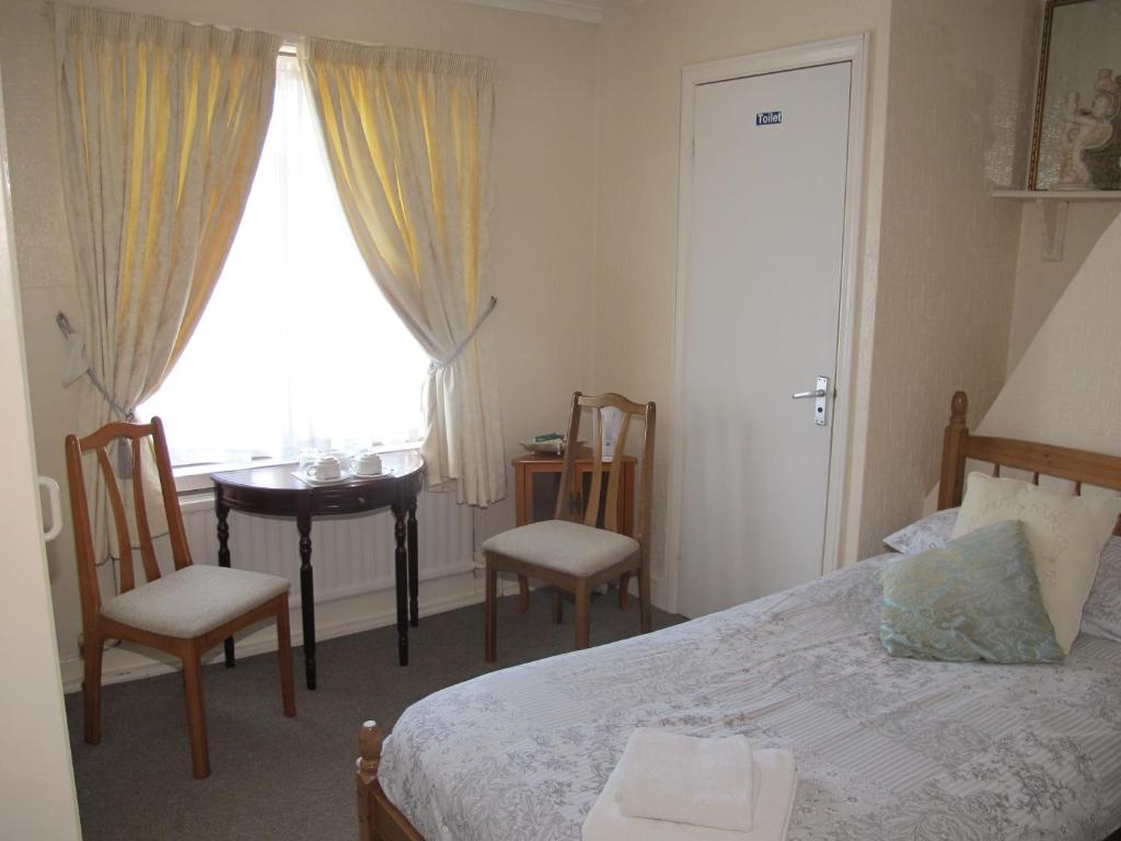 Postel nebo postele na pokoji v ubytování St Martins Guest House