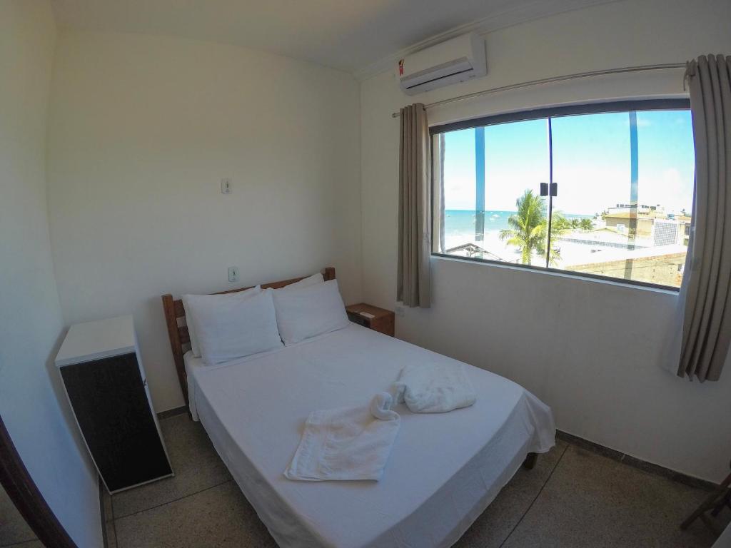 Postel nebo postele na pokoji v ubytování Maraga Beach Hostel