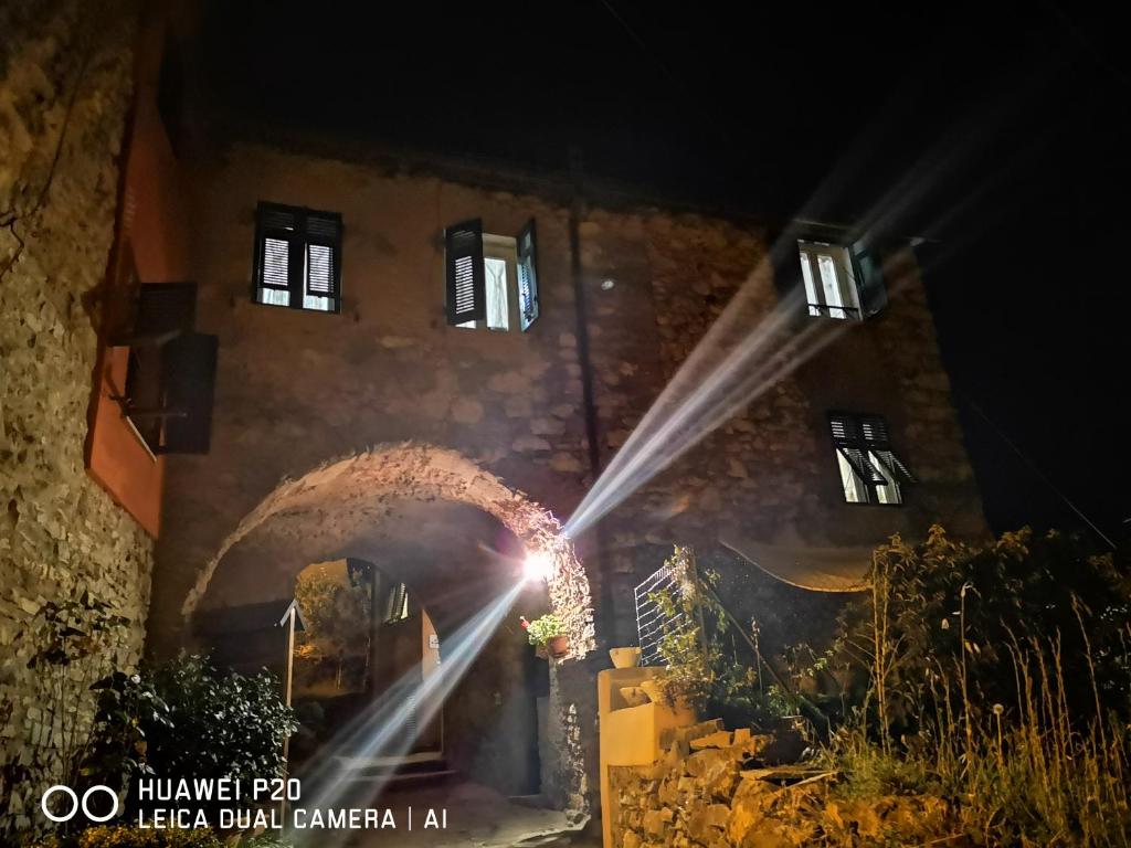 a building with a light in front of it at night at A Ridosso in Riccò del Golfo di Spezia