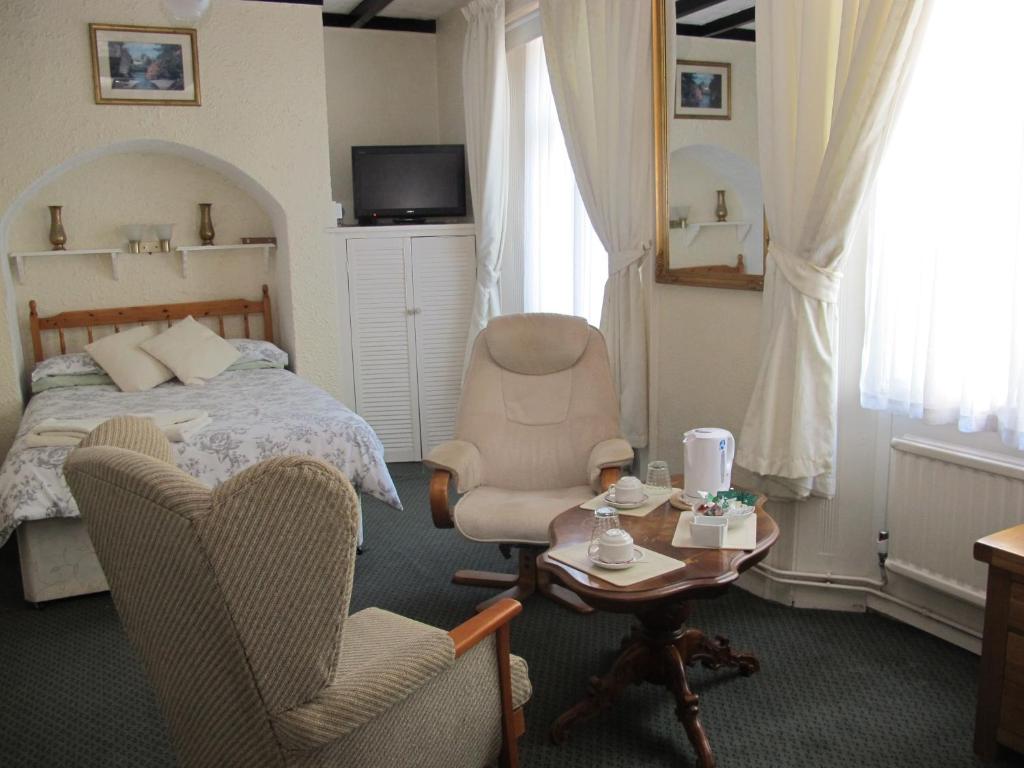 Postel nebo postele na pokoji v ubytování St Martins Guest House