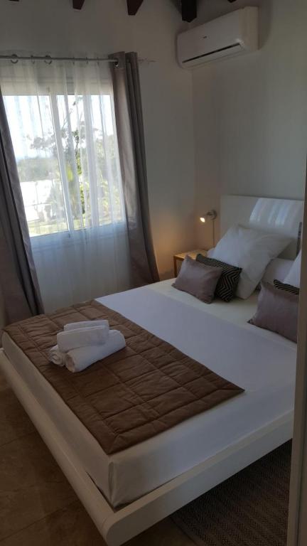 Postel nebo postele na pokoji v ubytování Villa Lorina