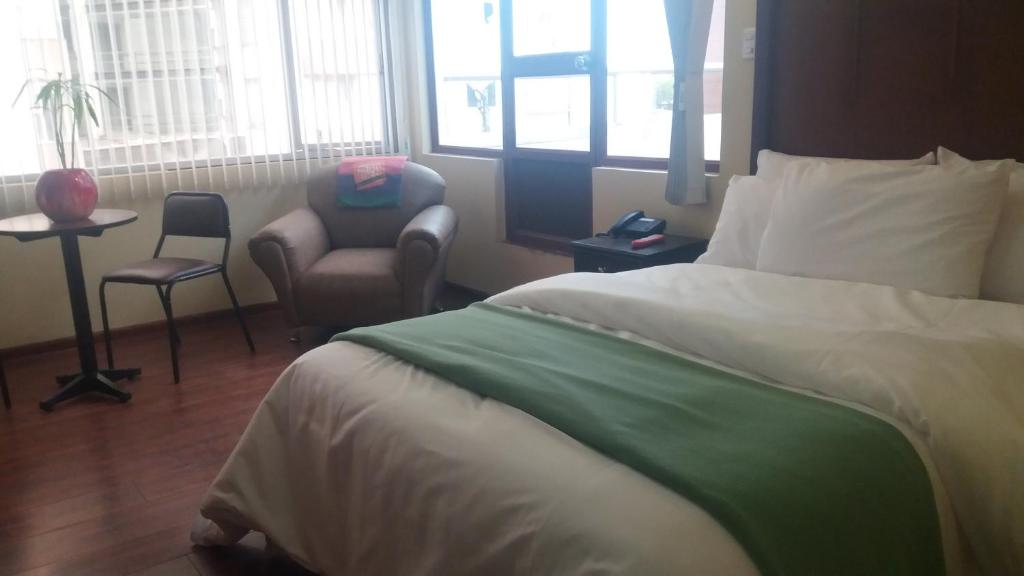 Postel nebo postele na pokoji v ubytování Hotel Saint Thomas