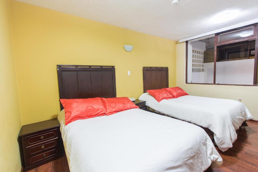Postel nebo postele na pokoji v ubytování Hotel Saint Thomas