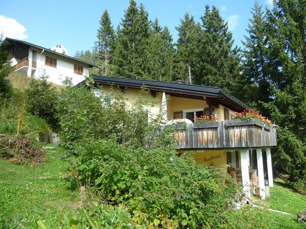 a house with a balcony on the side of it at Preschaint (720 Kü) in Valbella