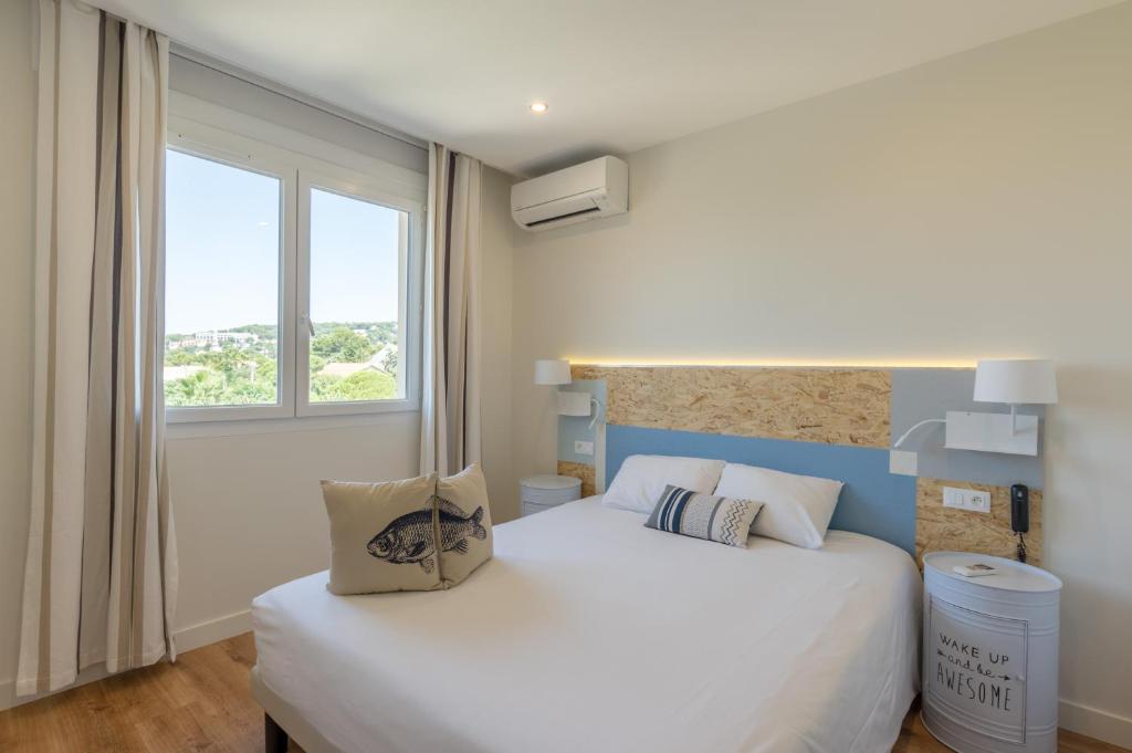 Postel nebo postele na pokoji v ubytování Cit'Hotel Imperial