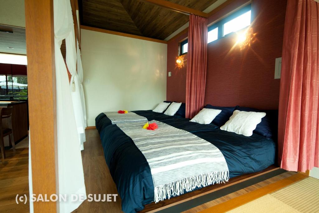 Postel nebo postele na pokoji v ubytování Bougain Terrace Resort Thi-chi House