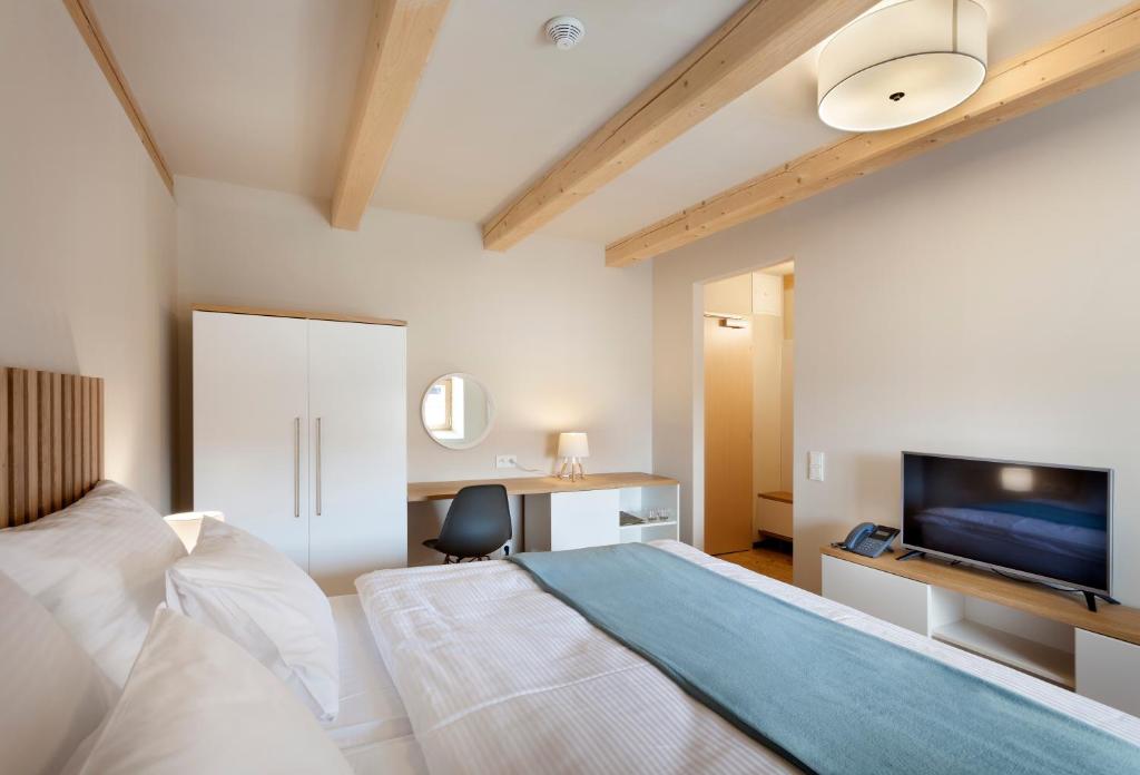 A bed or beds in a room at Hotel Kleis