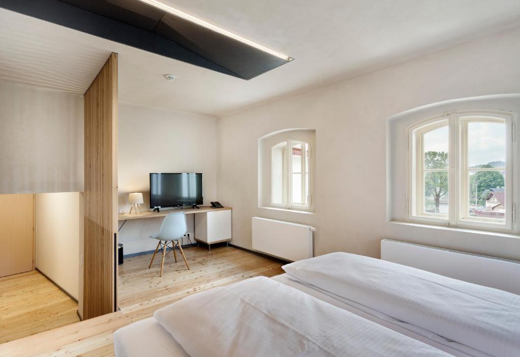 A bed or beds in a room at Hotel Kleis