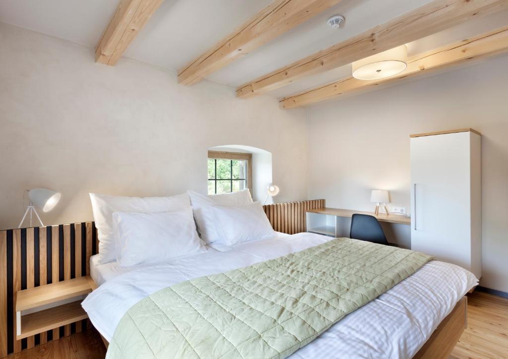 A bed or beds in a room at Hotel Kleis