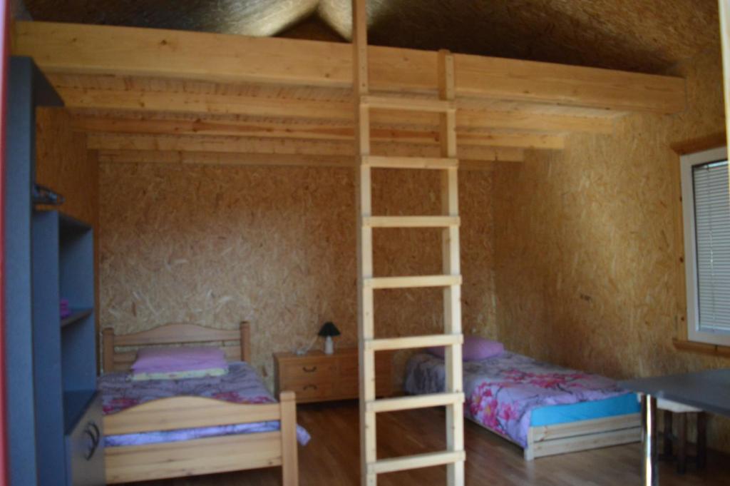 Postel nebo postele na pokoji v ubytování Metsjärve bangalo