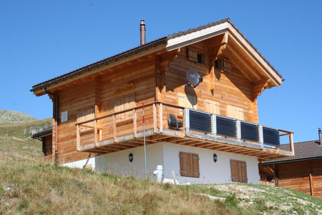 a house with solar panels on the side of it at Alpenlodge in Belalp
