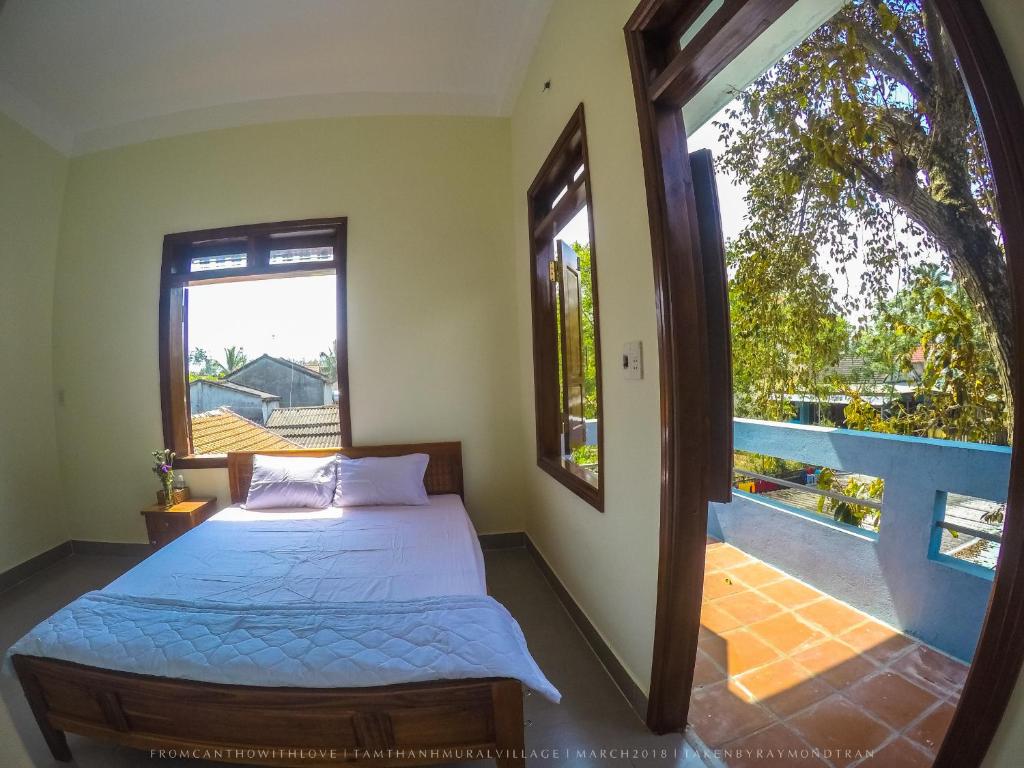 Postel nebo postele na pokoji v ubytování Ngoc Lan Homestay