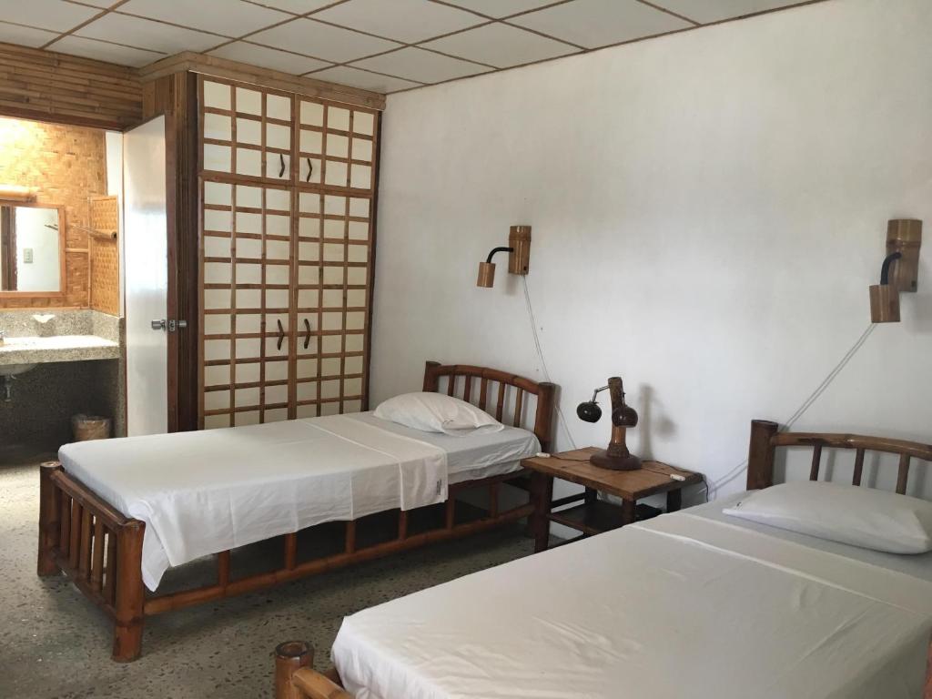 Postel nebo postele na pokoji v ubytování Costa Aguada Island Resort, Inampulugan Island, Sibunag, Guimaras